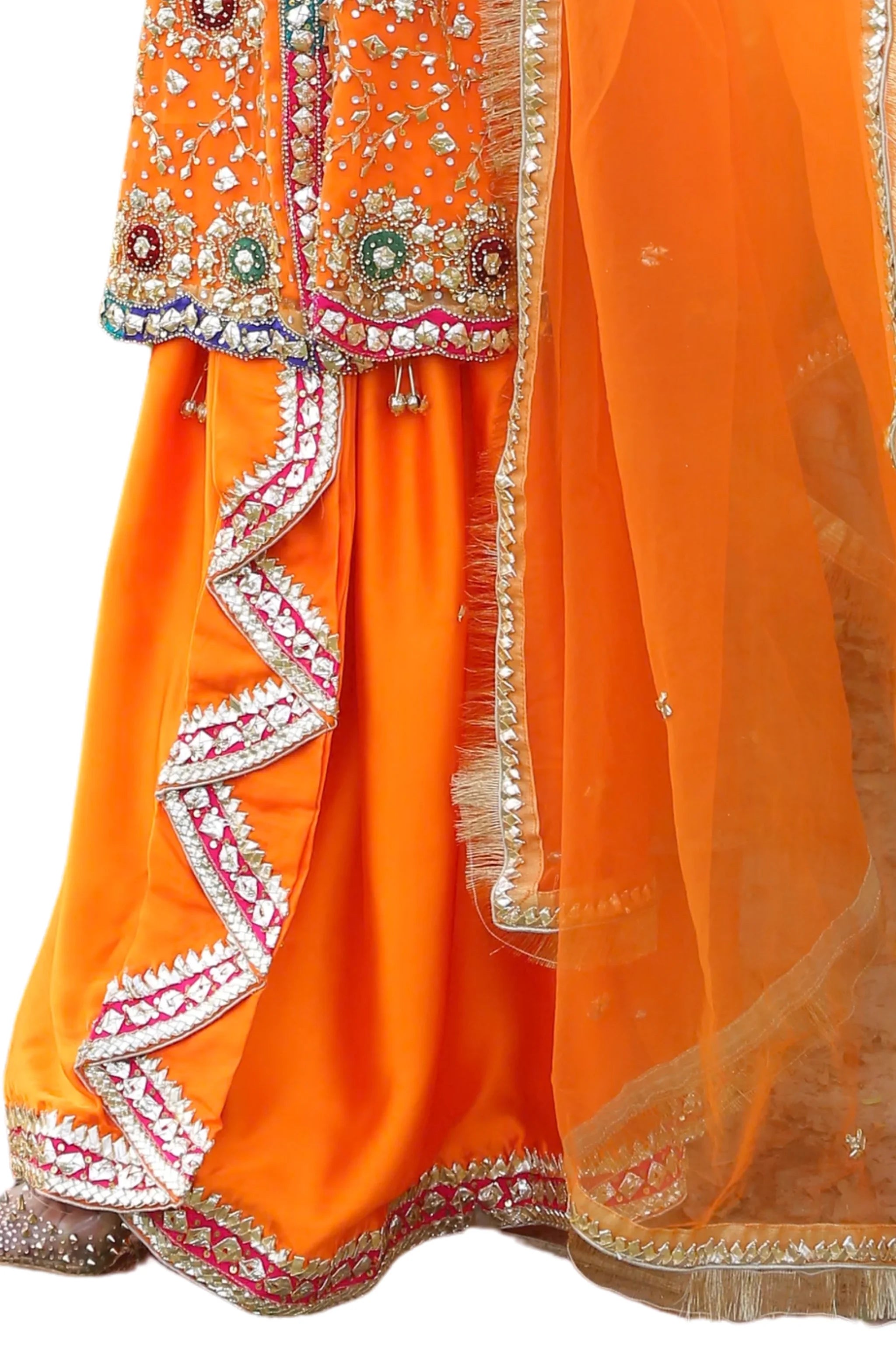 Close-up detail of Amber Dusk organza fabric featuring gotta work, beadwork, and star embellishments