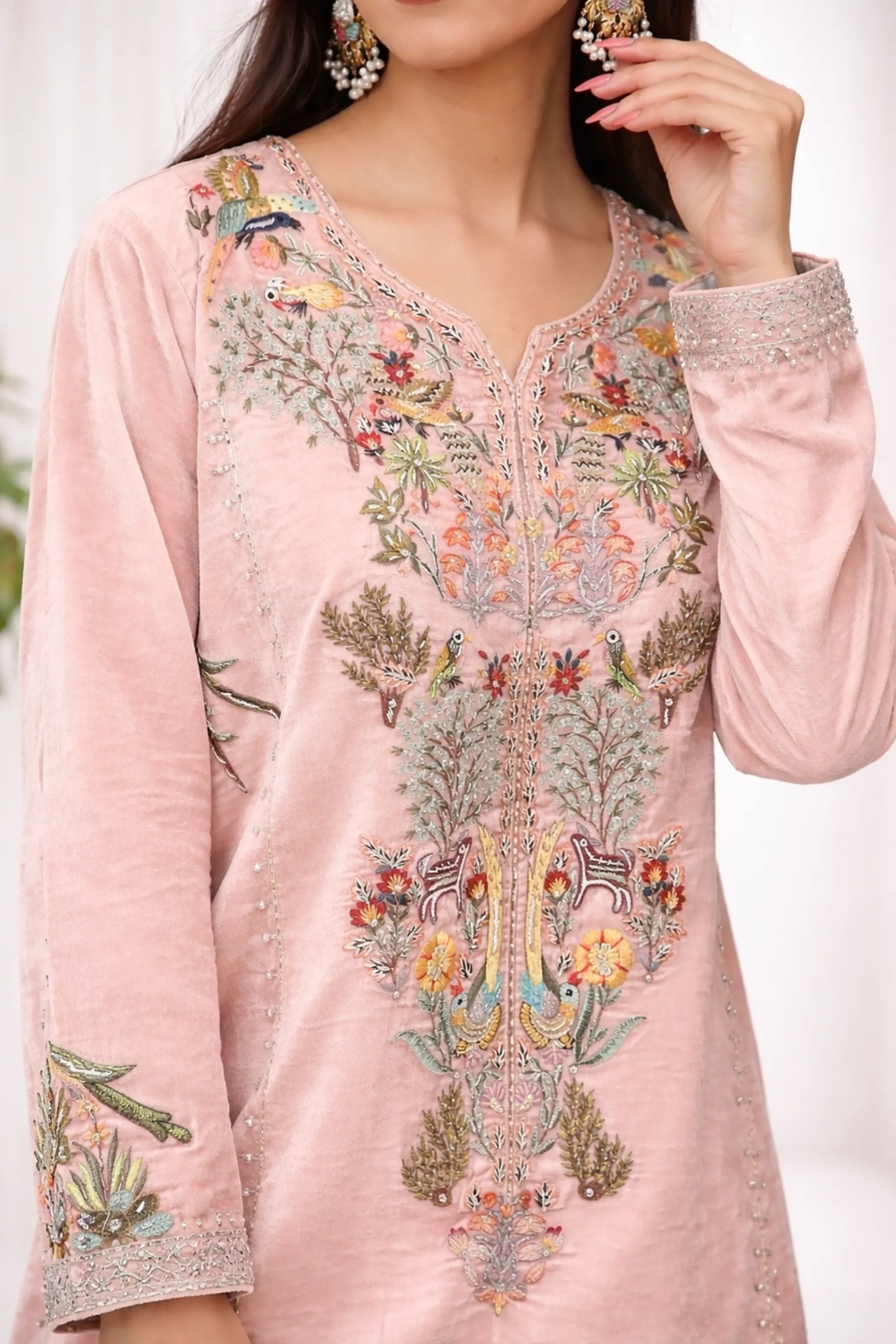 Close-up_of_intricate_floral_embroidery_on_velvet_fabric