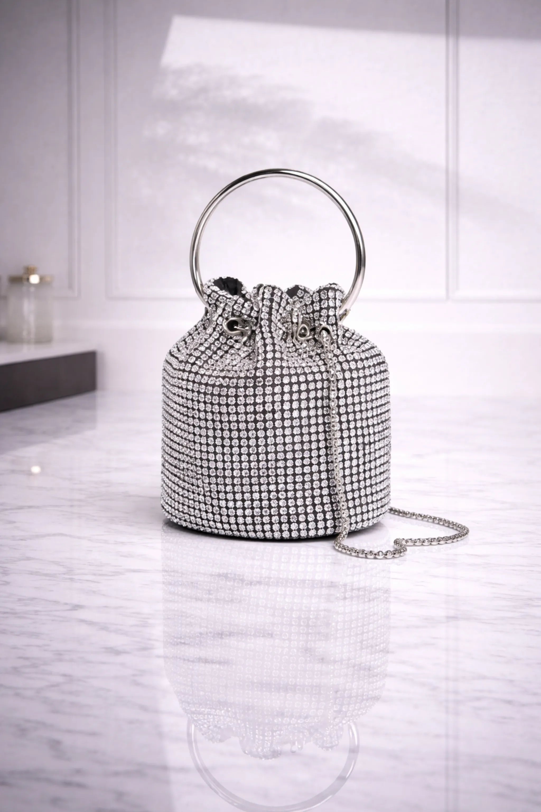 Lumière Cristal rhinestone bucket bag with metal ring handle – front view
