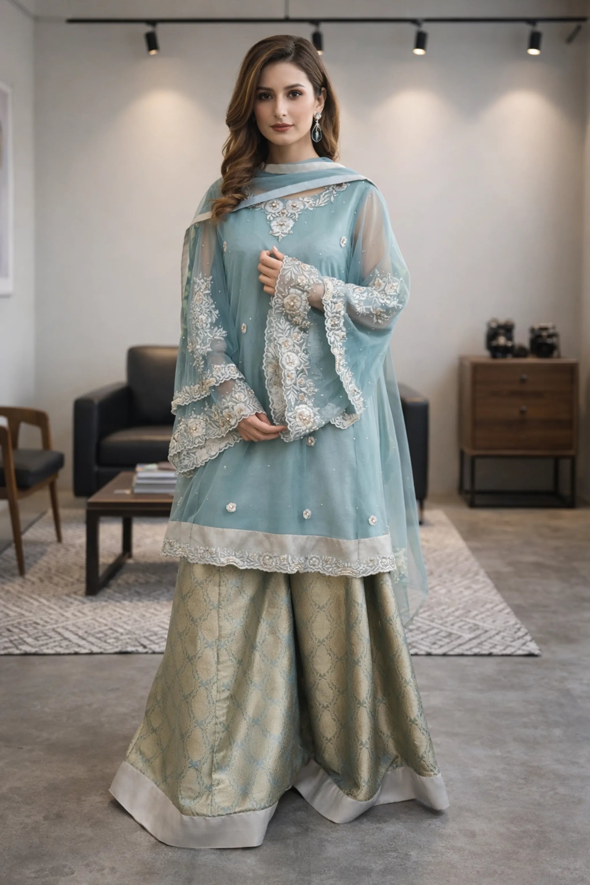 Pastel teal embroidered A-line frock with sheer net sleeves and pearl detailing paired with olive gold brocade sharara