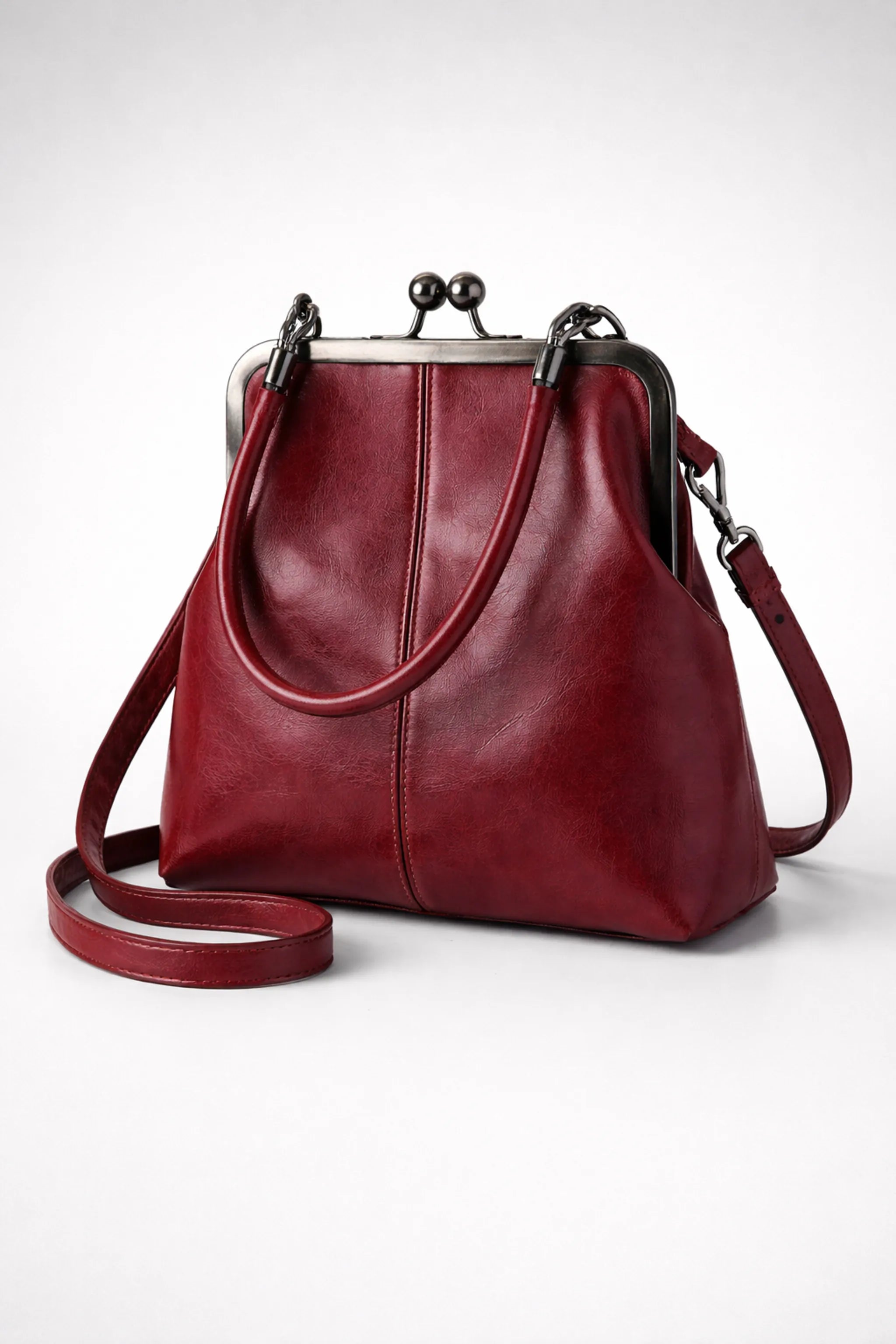 Red wine kiss-lock mini top handle bag, 20 cm wide PU leather handbag, front view