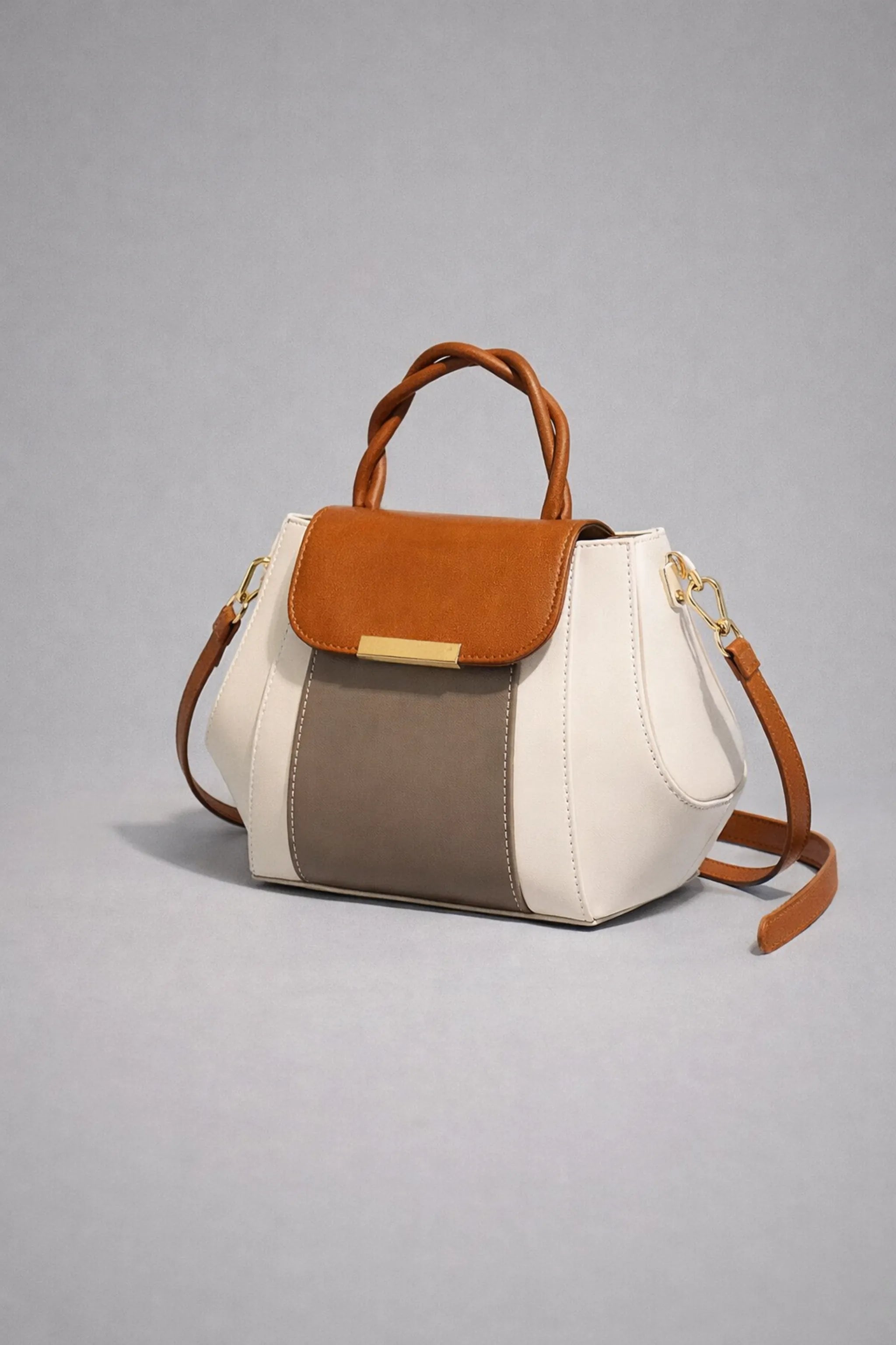 Side view showing structured silhouette and colour-block panels