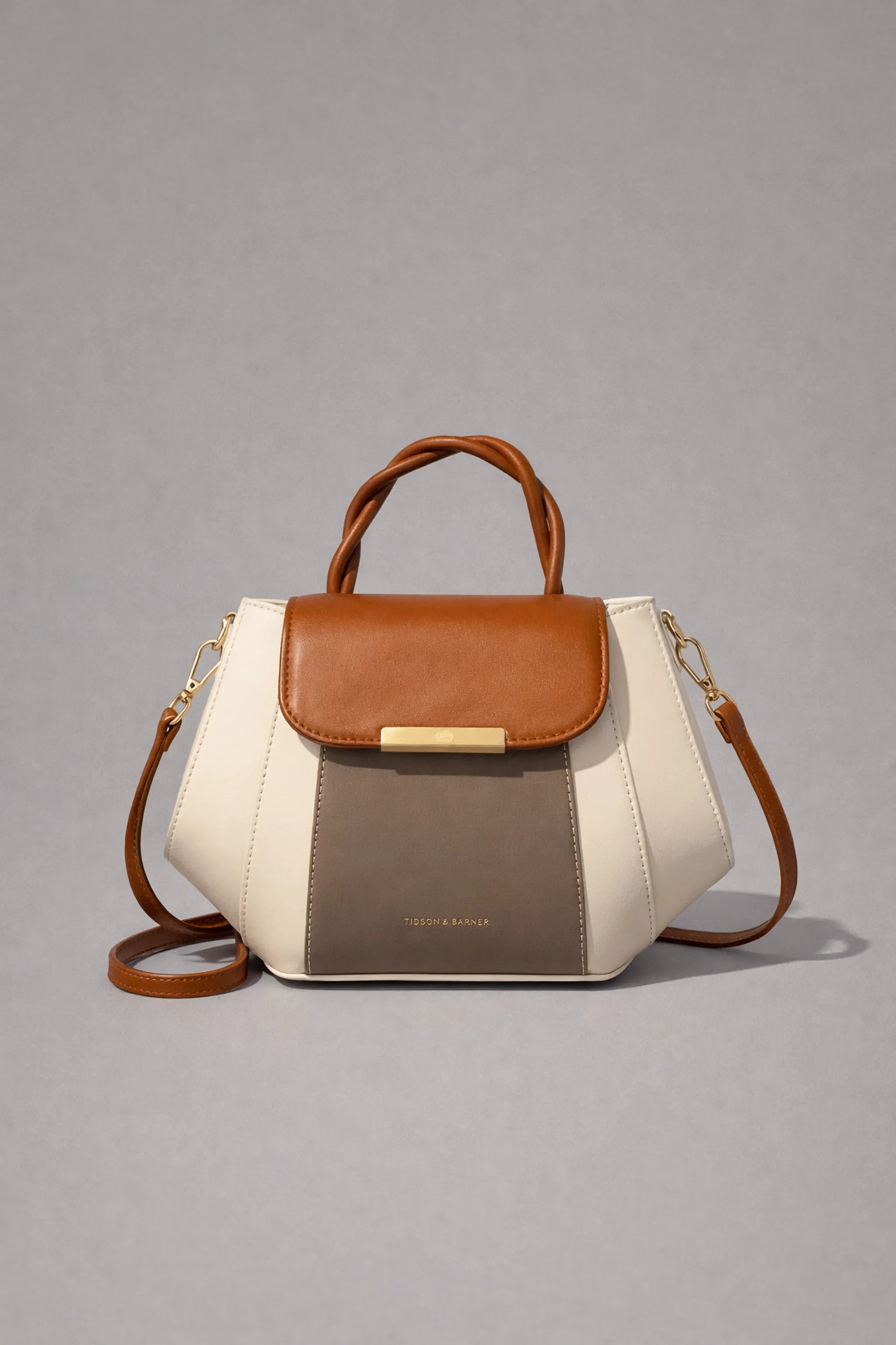 Tri-tone structured mini handbag front view with top handle