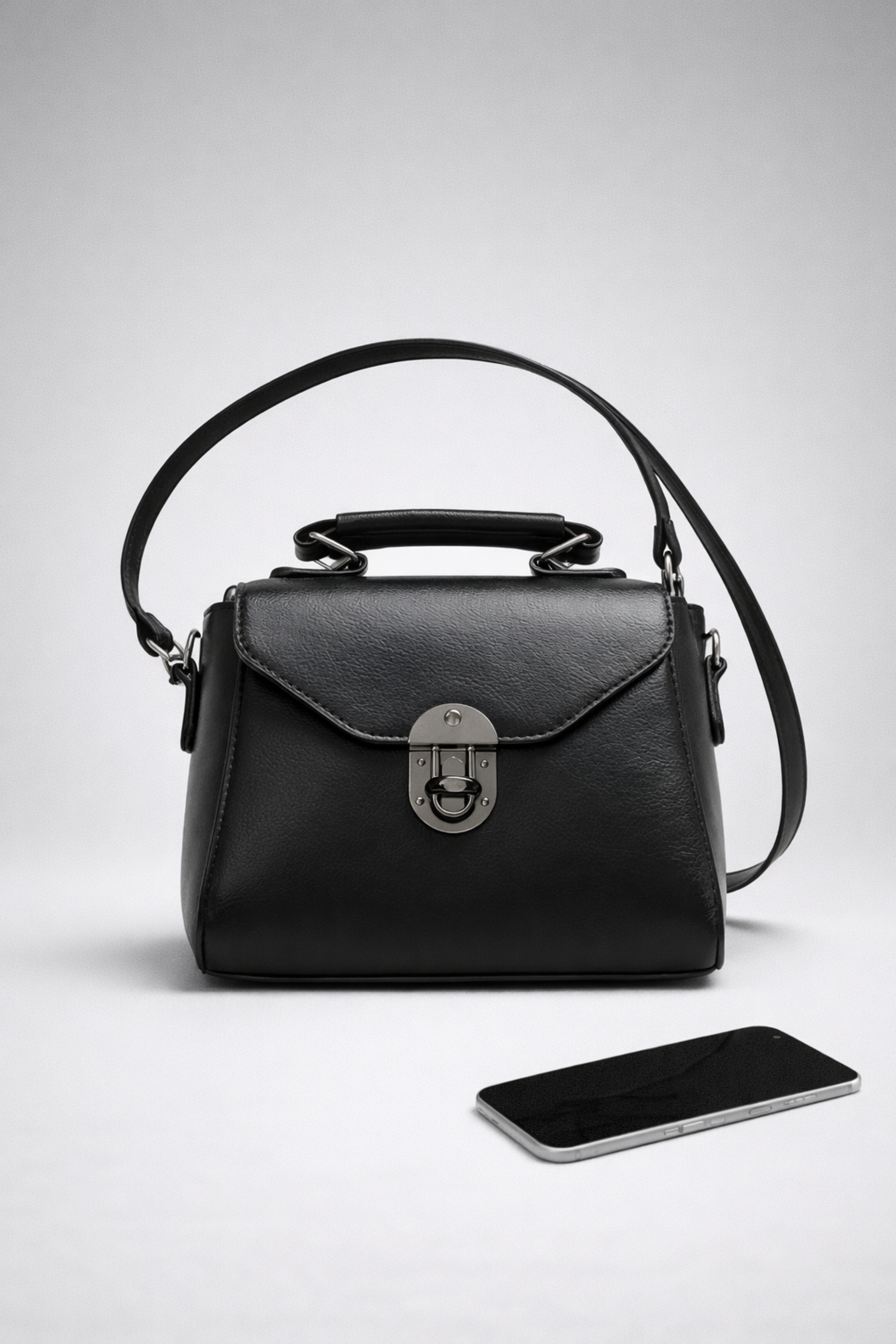 “Vintage black mini square PU leather bag with buckle closure and top handle”