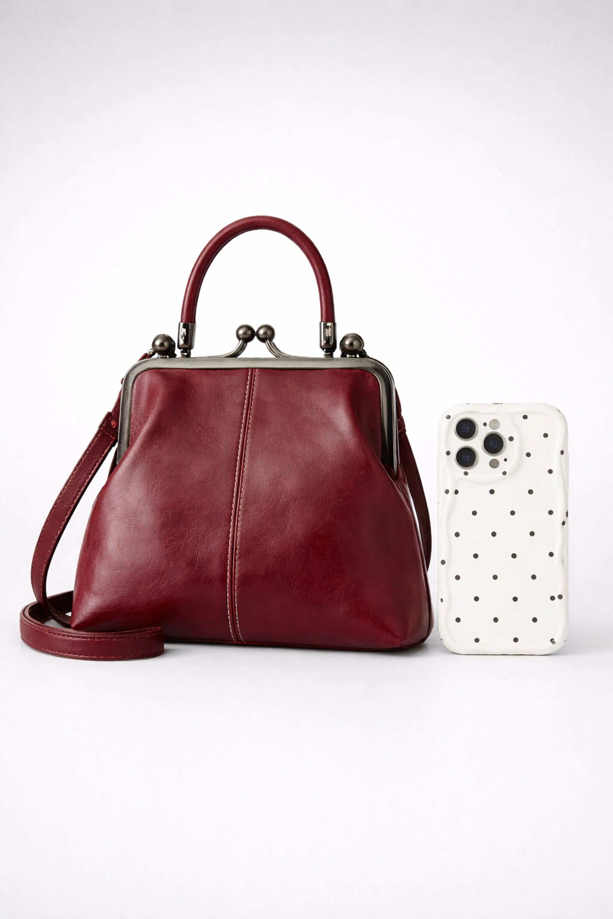 Vintage red wine PU leather kiss-lock bag with 23 cm height and metal frame closure